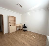 A room in a 3-room apartment with furniture and a wooden decor floor.