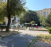 A children's playground surrounded by greenery on Sklenárova Street in Bratislava - Ružinov.