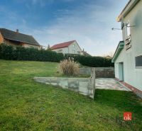 A family house in Suchá nad Parnou with a spacious garden and a paved terrace.