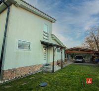 A family house in Suchá nad Parnou with a garage and a green yard.