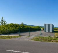 Lands - housing on street 504 in Modra, green fence, container.