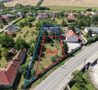 Aerial view of residential plots in Čaradice with houses and greenery.