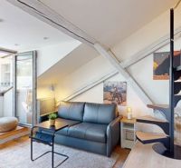Interior of a 1-room apartment with a sofa, staircase, and balcony, floor with wood decor.