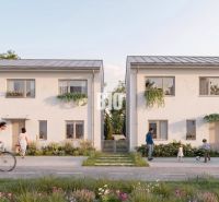 Family houses in Nitra with landscaped gardens, people cycling and playing.