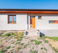 A family house in Nitra with a light facade and entrance stairs.