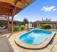 A family house in Nitra with a swimming pool, terrace, and a gazebo in the garden.