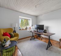 Yellow chair, work desk with a monitor, wooden decor flooring, family house.