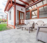 A family house in Nitra with a garden seating area on a paved terrace, a space for relaxation.