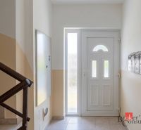 Entrance hall of a 4-room apartment with a staircase and mailboxes.