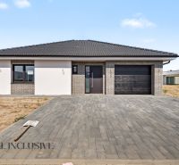 A family house in Hviezdoslavov with a brick facade and a spacious paved driveway.
