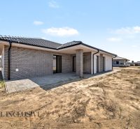 A family house in Hviezdoslavov with a gray brick facade and a spacious terrace.