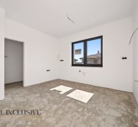 An empty room with a window and prepared electrical installation in a family house.