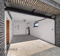 A garage in a family house in Hviezdoslavov with brick cladding and underfloor heating.