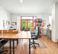Office space in a 3-room apartment with office furniture and a wooden decor floor.