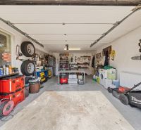 A garage in a family house with tools and instruments on the shelves.