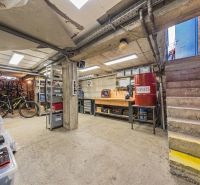 Basement space in a family house with storage space and bicycles.