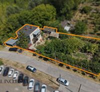 A family house in Bodza with an extensive garden, parking, and a fenced plot.