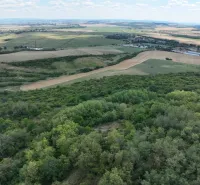Agricultural and forest land in Tornaľa with a panoramic view of the surrounding countryside.