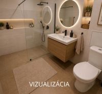 A modern bathroom with wood, a shower, a lighted mirror, and decorative elements in a two-room apartment.