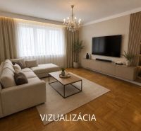Living room with a corner sofa, TV, and wood-patterned flooring in a two-room apartment.