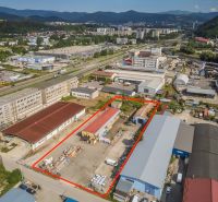 A building on Zvolenská Road in Banská Bystrica with industrial halls and warehouses.