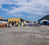 The area on Zvolenská Road in Banská Bystrica with buildings and storage facilities.