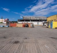 The building on Zvolenská Street in Banská Bystrica with blocks and a warehouse in the yard.