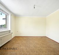 An empty room with a wooden decor floor in a family house.