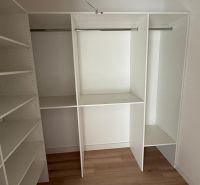 Built-in wardrobe in a 3-room apartment, with a wooden decor floor.