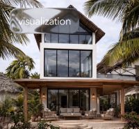 A family house in Pwani Mchangani with palm trees and a spacious veranda.