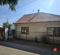 A family house on Stračia Street in Nitra with a white facade and a sloped roof.