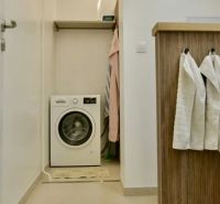 Washing machine with storage space in the bathroom of a 3-room apartment.