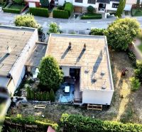 A view from above of the roof and garden of a family house in Nové Zámky.