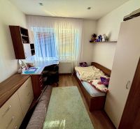 Children's room with a bed, desk, wardrobe, and floor with wooden decor.