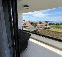 View from the balcony of a 3-room apartment in Privlaka, overlooking the sea and rooftops.