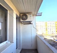 The balcony of a 3-room apartment on Dudvážska Street in Bratislava, overlooking the neighboring buildings.
