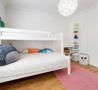 A children's room with a bunk bed and decorations in a 3-room apartment.
