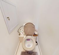 A bathroom with accessories and a cabinet in a 3-room apartment.
