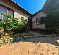 A family house on Školská Street in Tesárske Mlyňany with a terrace and vegetation.
