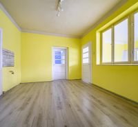 Yellow walls and a wooden decor floor in a family house.