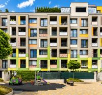 Modern building with a colorful facade and a children's playground on Nejedlého Street, Bratislava - Dúbravka.