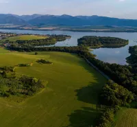 Green fields, forests, and a water area near Liptovský Trnovec, Unique properties.