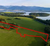 Aerial view of the Special Properties in Liptovský Trnovec with surroundings and water surface.