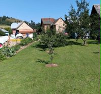 A garden with a lawn and fruit trees near houses in Ovčiarsko, Plots - living.