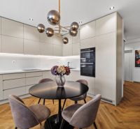 The 3-room apartment includes a kitchen with furniture and a floor with a wooden decor.
