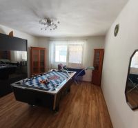 Family house with a billiard table, wood-decorated flooring, and a bright room.
