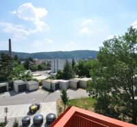 View from a 3-room apartment on Pred poľom Street in Trenčín with hills and trees.