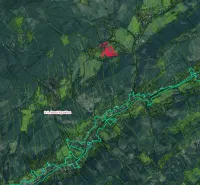 Aerial photograph of the Nová Bystrica landscape with agricultural and forest lands, highlighted area.