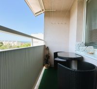 The balcony of a 3-room apartment on Martina Rázusa Street in Michalovce with rattan seating.