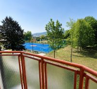 The balcony of a 2-room apartment on Mateja Bela Street in Žilina with a view of the playground.